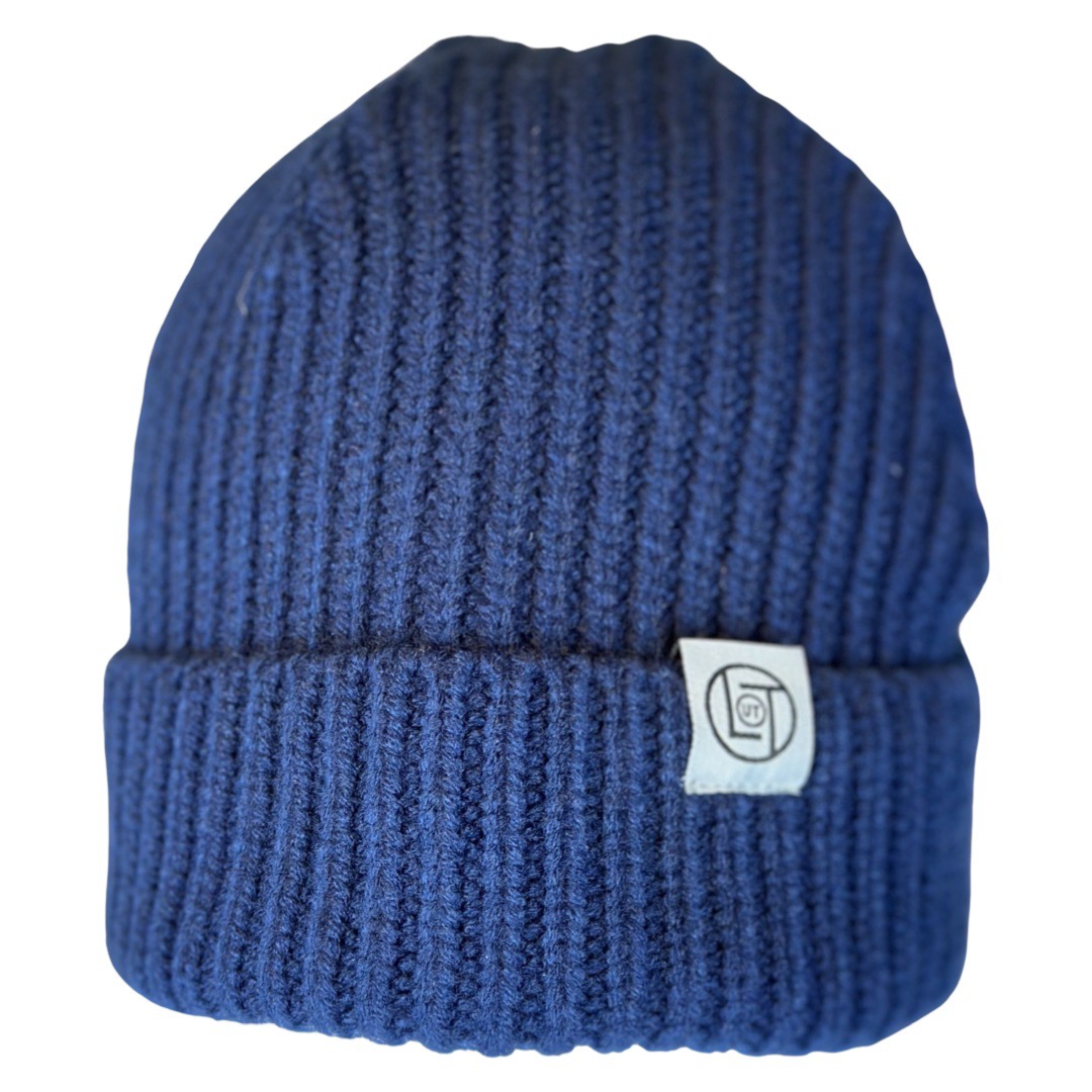 The Men's Knit Beanie in navy by Life Out There Apparel features a folded brim and a small logo tag on the side, making it a perfect addition to any men's wardrobe.