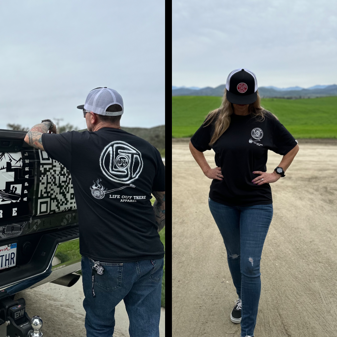 Life Out There Apparel “Branded” Unisex black tee shirt is a round logo of the companies initials, made with a hot branding iron. This is a photo of a man & women wearing the shirt.