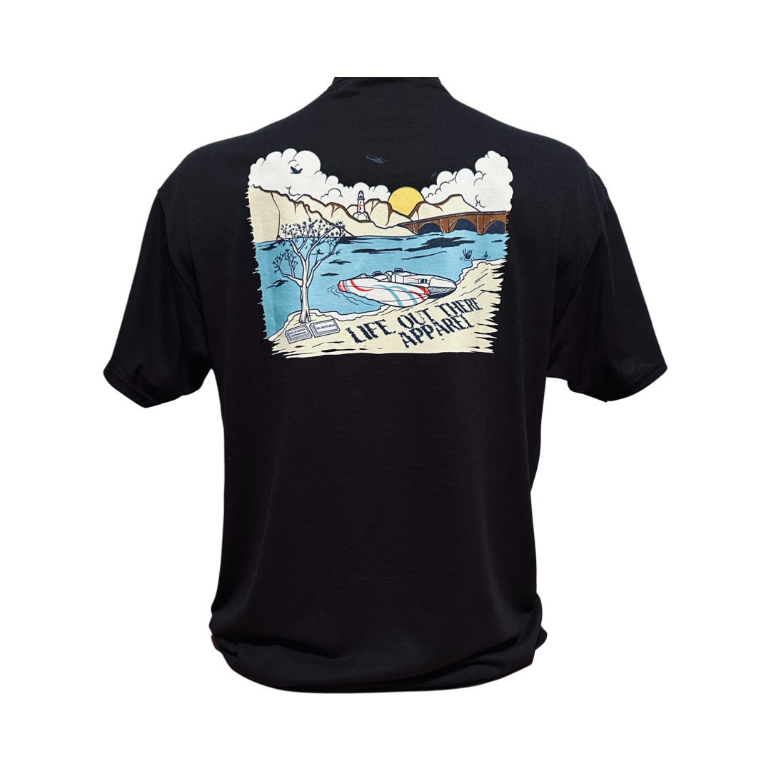 Unisex The Havasu T Shirt - Black by Life Out There Apparel showcases a scenic design with a summer lake vibe, featuring mountains and a boat at sunset. The illustration is complemented by the text LIFE OUTDOOR APPAREL, capturing the tranquility of Lake Havasu.