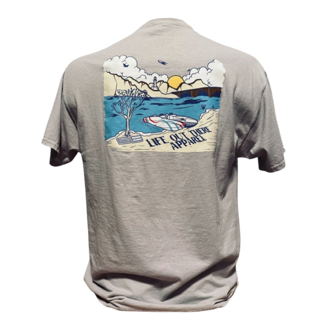 Silver T-shirt from Life Out There Apparel's "Unisex The Havasu T Shirt" collection, showcasing a vibrant design on the back with a scenic outdoor landscape of mountains, Lake Havasu, a boat, and a tree that captures the essence of summer vibes.
