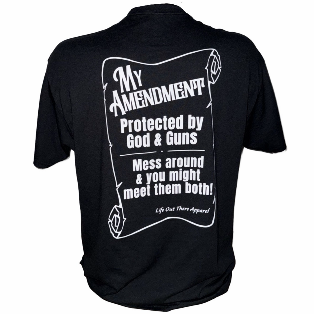 The My Amendment Tee - Black by Life Out There Apparel features bold white text—"My Amendment. Protected by God & Guns. Mess around & you might meet them both!"—on a scroll graphic in this striking faith-based T-shirt.