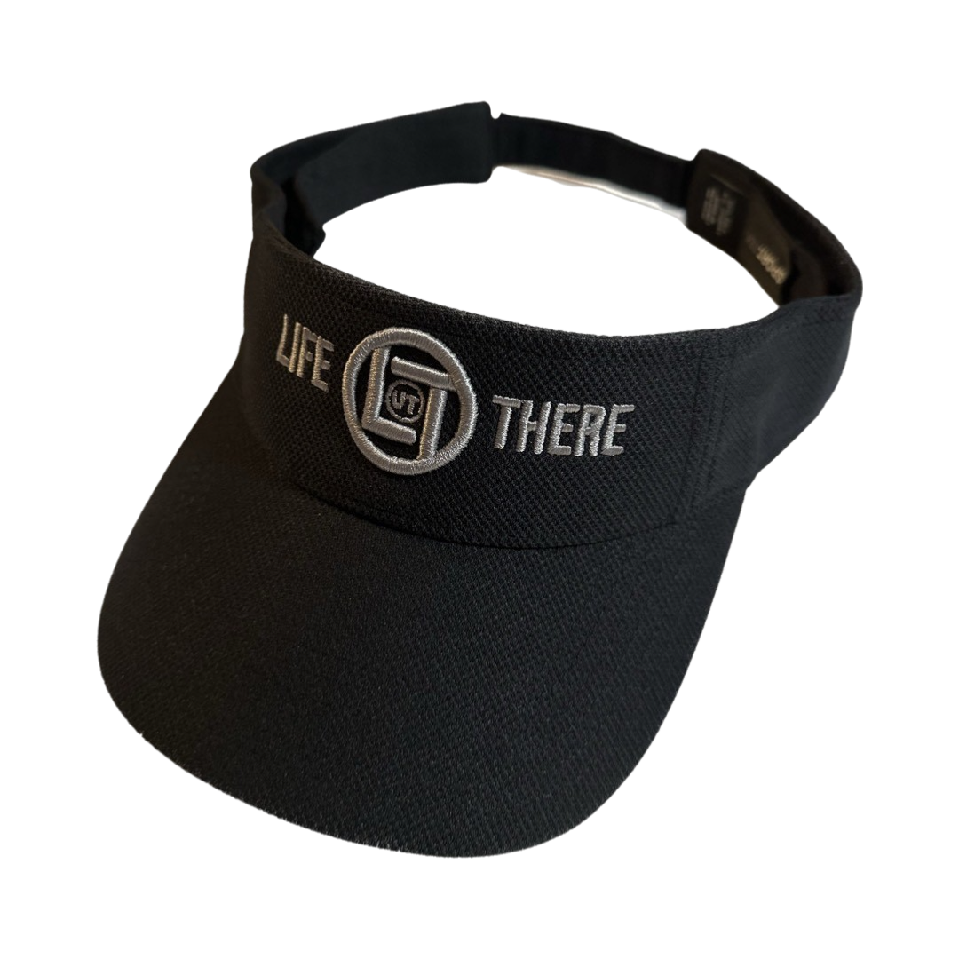 Black sun visor from Life Out There Apparel with the phrase "Life Out There" and a circular logo embroidered on the front.