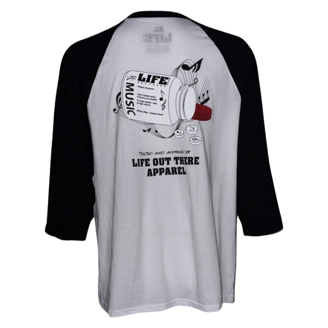 Black & White Life Out There Apparel “Music Is Medicine “ Unisex Raglan 3/4 tee shirt is a medicine pill bottle tipped over with pills that have fallen out, that have music notes on them. This photo is of the back of the shirt on a white background.