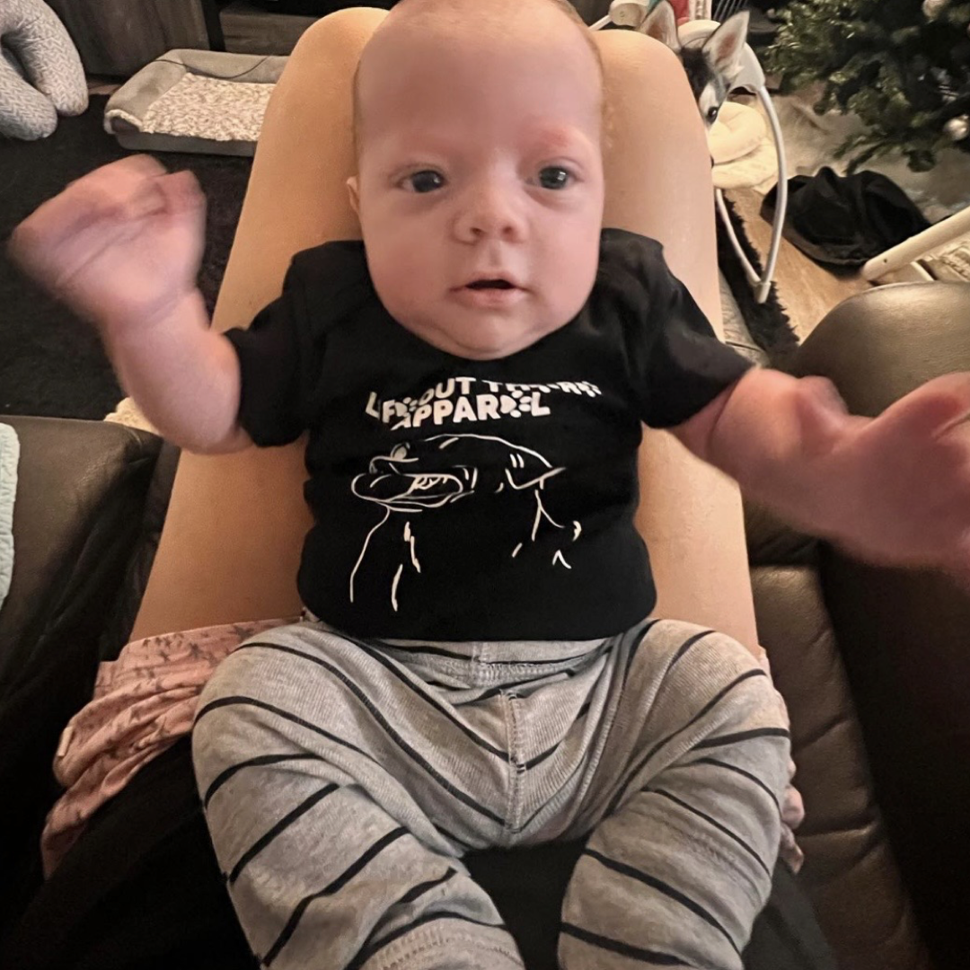 Life Out There Apparel “Best Friend” Unisex baby onesie in black. This is a tribute to our best friend who is a Labrador retriever dog on a hike with his humans.