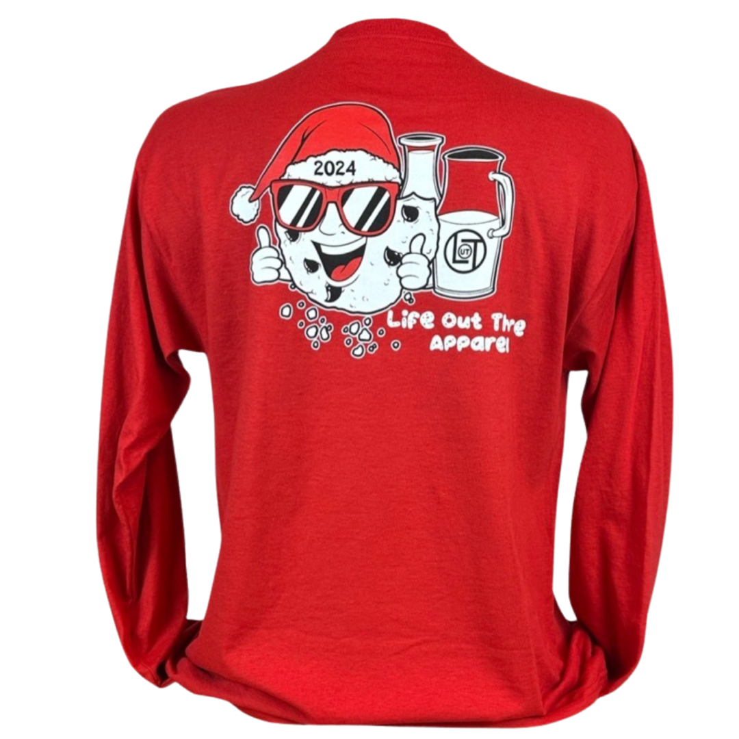 Red shirt with a cartoon cookie wearing a Santa hat and sunglasses labeled "2024," alongside glass milk cartons. Text reads, "Life Out The Apparel.