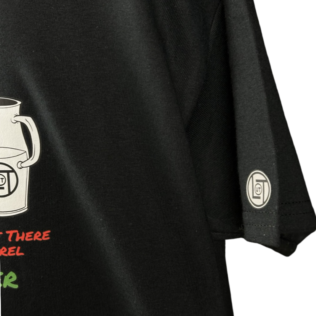 Black short sleeve youth t-shirt with a cartoon cookie wearing a Santa hat and sunglasses labeled "2024," alongside glass milk cartons. Text reads, "Life Out The Apparel / official cookie tester”.