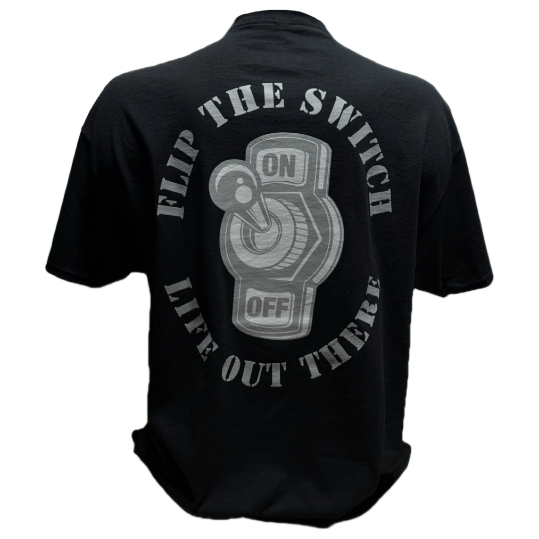 The Unisex Flip The Switch Tee from Life Out There Apparel features a bold center graphic of a toggle switch labeled ON and OFF, encircled by the adventurous text FLIP THE SWITCH LIFE OUT THERE, capturing bold, innovative style.