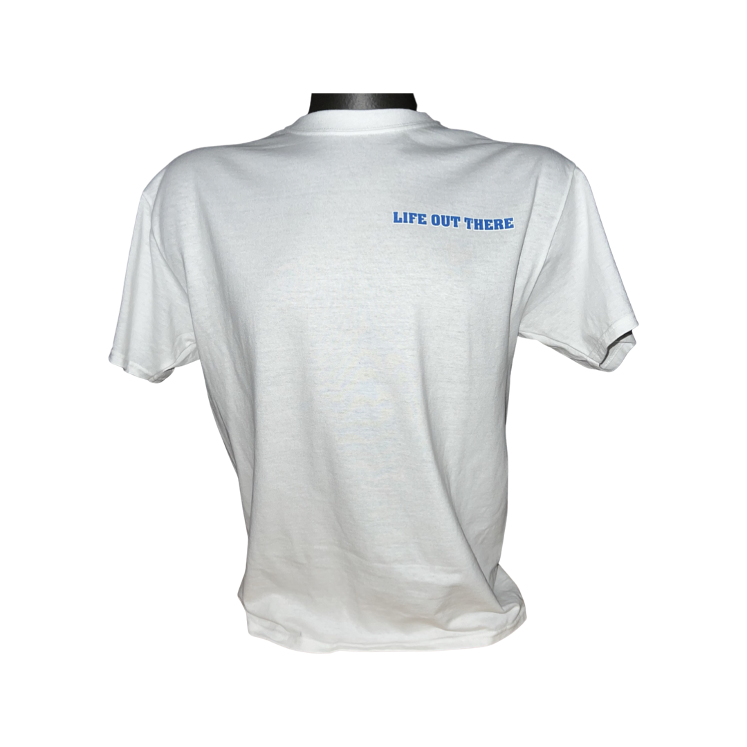 Displayed on a black stand, the Unisex The Freedom Tee in white by Life Out There Apparel features the phrase "LIFE OUT THERE" in blue on the upper back, capturing an American spirit with a touch of freedom.