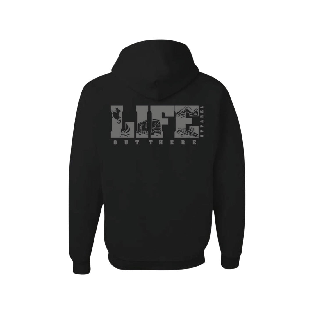 This cozy Unisex The OG Hoodie - Black/Grey from Life Out There Apparel features LIFE in large gray letters on the back, with each letter intricately filled with small graphic elements like mountains and trees. Below LIFE, it displays the brand's name, Life Out There Apparel. Ideal for camping adventures, the hood is drawn up against a crisp white background.