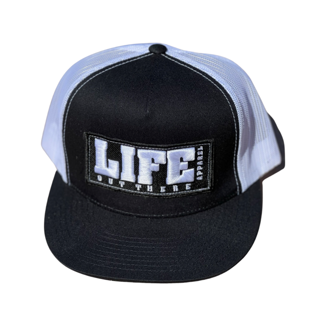 Introducing the Life Out There - Puff Embroidered SnapBack Trucker Hat in Black/White by Life Out There Apparel. This cap features a black front panel and white mesh back. The front is adorned with a patch displaying the bold text "LIFE" and below it, the smaller text "OUT THERE APPAREL.