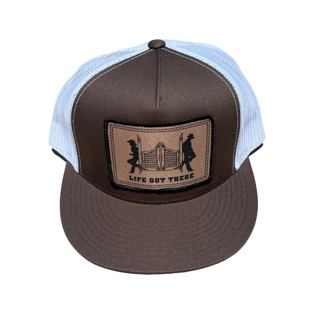 The Life Out There - THE YEEHAW SnapBack Trucker Hat by Life Out There Apparel is a stylish brown and white cap featuring a front patch with silhouettes of a man and woman separated by a gate, alongside the phrase "LIFE OUT THERE.