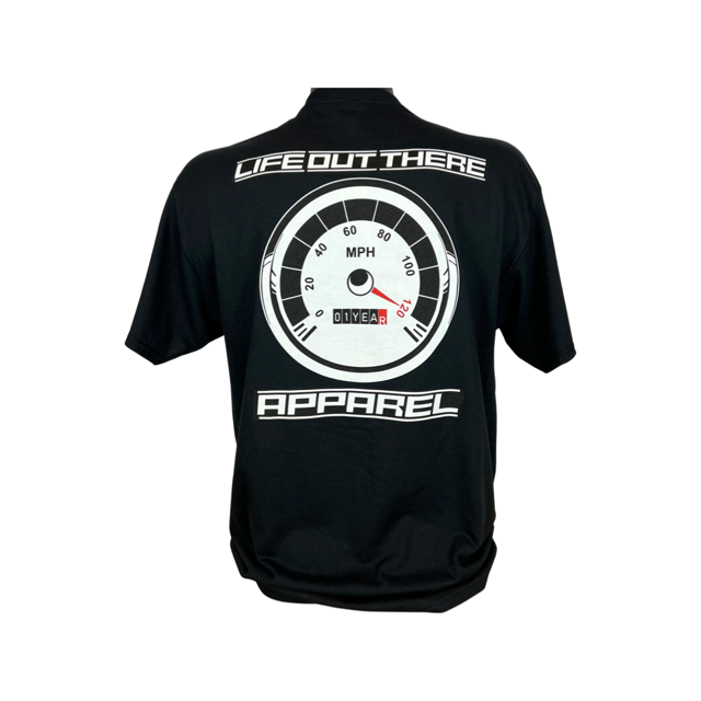 Life Out There Apparel “On My Way” Black Unisex tee shirt is the 1 year anniversary design that has a big speedometer on it - pegged at 120 mph & the odometer is rolling over 1 Year. This photo shows a man showing the design on the back of the shirt with a white background.
