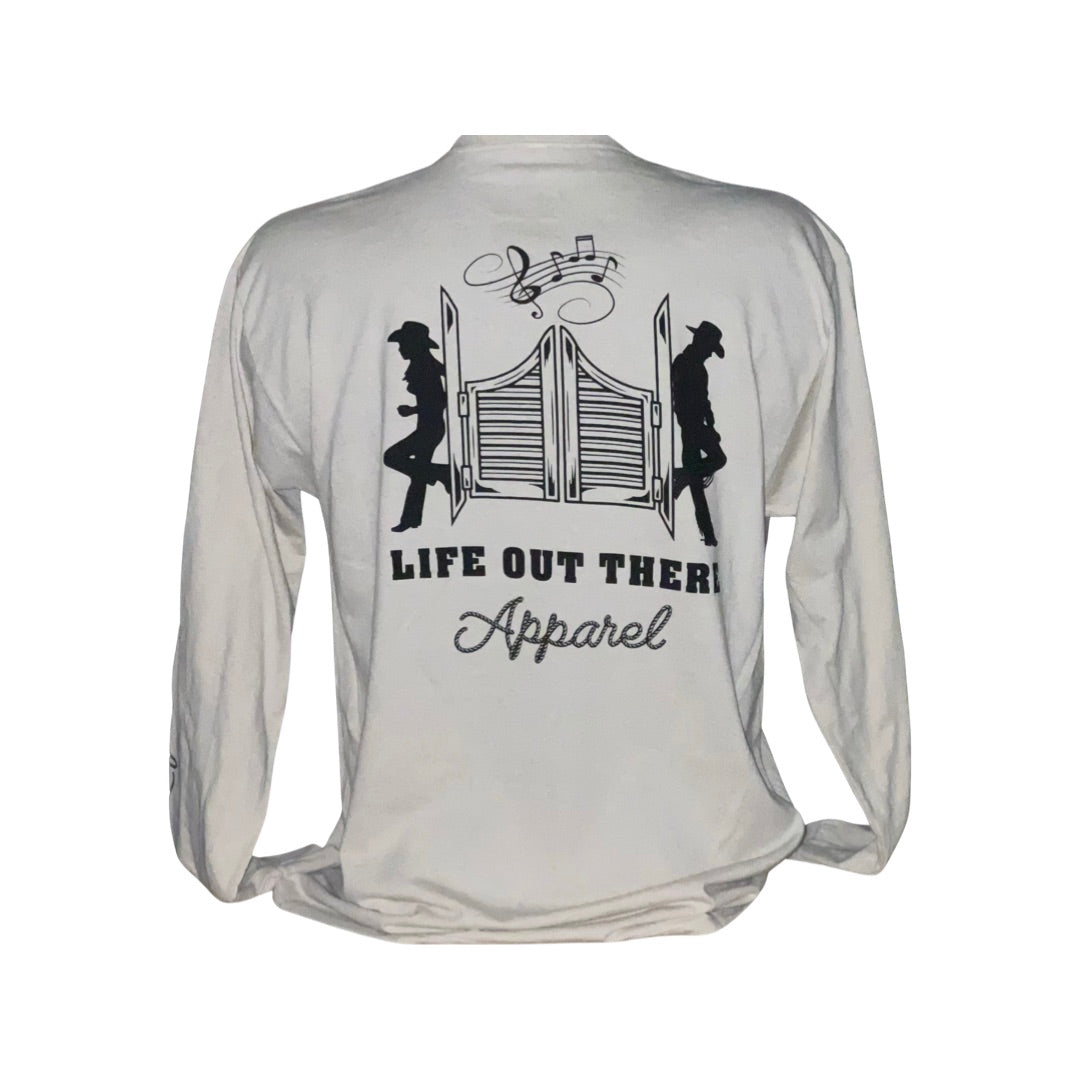 Back view of the Unisex THE YEEHAW Long Sleeve T Shirt in Sandstone/Black, showcasing two cowboy silhouettes leaning against saloon-style doors. Musical notes capture the essence of country music, with the text reading Life Out There Apparel. Perfect for those who embrace ranch life and the spirit of Yeehaw!