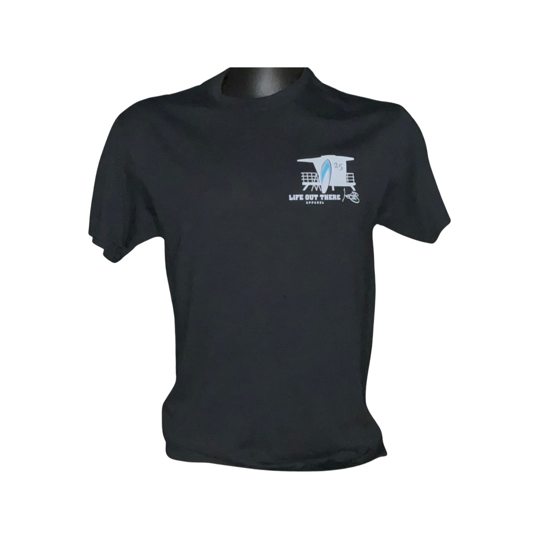The Unisex The JJ T Shirt - Black from Life Out There Apparel features a small graphic on the left chest area, showcasing a blue guitar along with musical symbols and the phrase "Life on the Riffs." Ideal for complementing your beachwear, this t-shirt captures the relaxed atmosphere of a summer getaway. Displayed against a simple white backdrop.