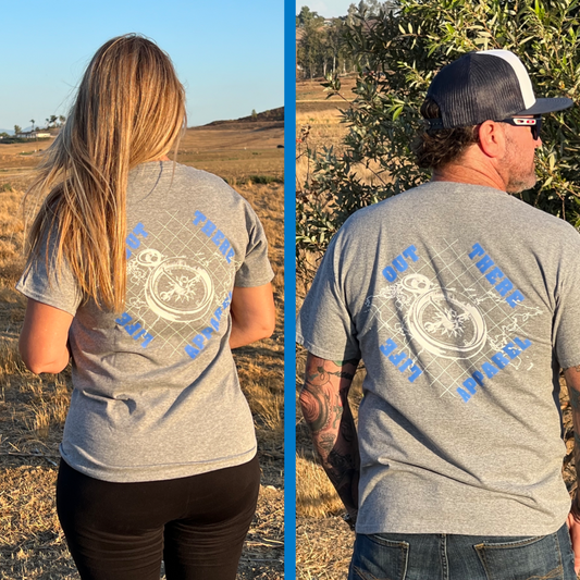 Life Out There Apparel “A New Path” Unisex Oxford grey tee shirt has a woman & a man wearing this shirt. The design has a nautical feel with a compass on top of an atlas. This design was created in support of suicide awareness. 
