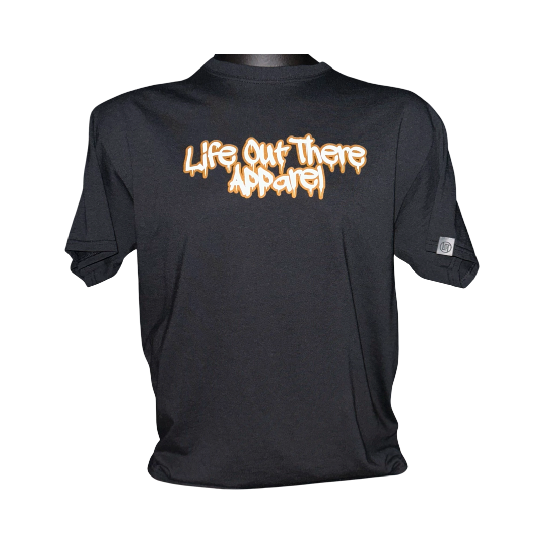 Life Out There Apparel “Fun is Not a Crime” Black Unisex tee shirt has a skateboarder and bmx rider having fun on a half pipe skateboard ramp. This picture has the front of the shirt, which look like it was spray painted, with a transparent background. 