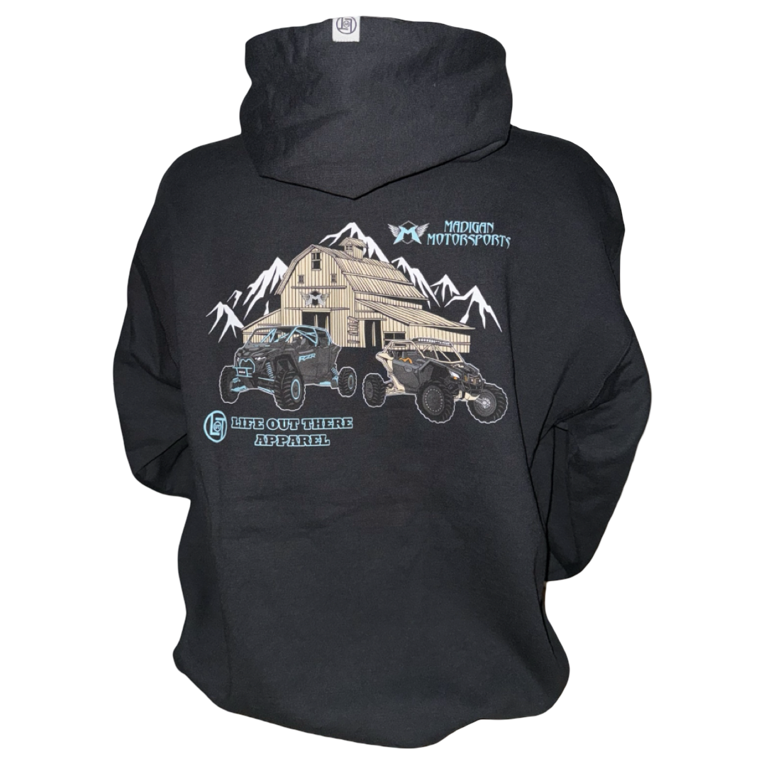 The Unisex - Side X Side Hoodie - Black by Life Out There Apparel features a graphic of a barn, mountains, and Side X Side vehicles—perfect off-road wear for fans of Madigan Motorsports.