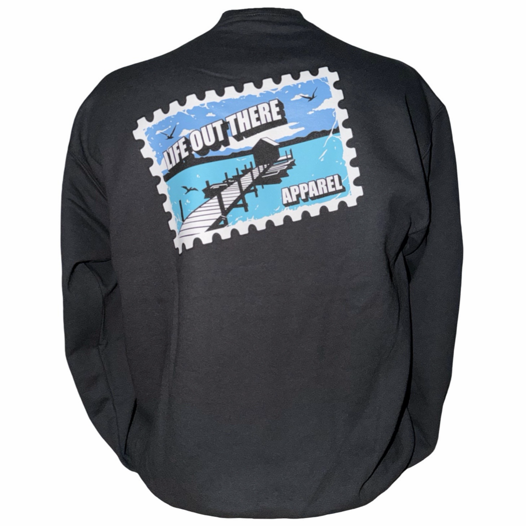 The Wish You Were Here Crewneck Sweatshirt in black by Life Out There Apparel features a large postcard-style back graphic—a dock over water, birds, blue sky, and “LIFE OUT THERE APPAREL.” The perfect unisex sweatshirt to say "wish you were here.