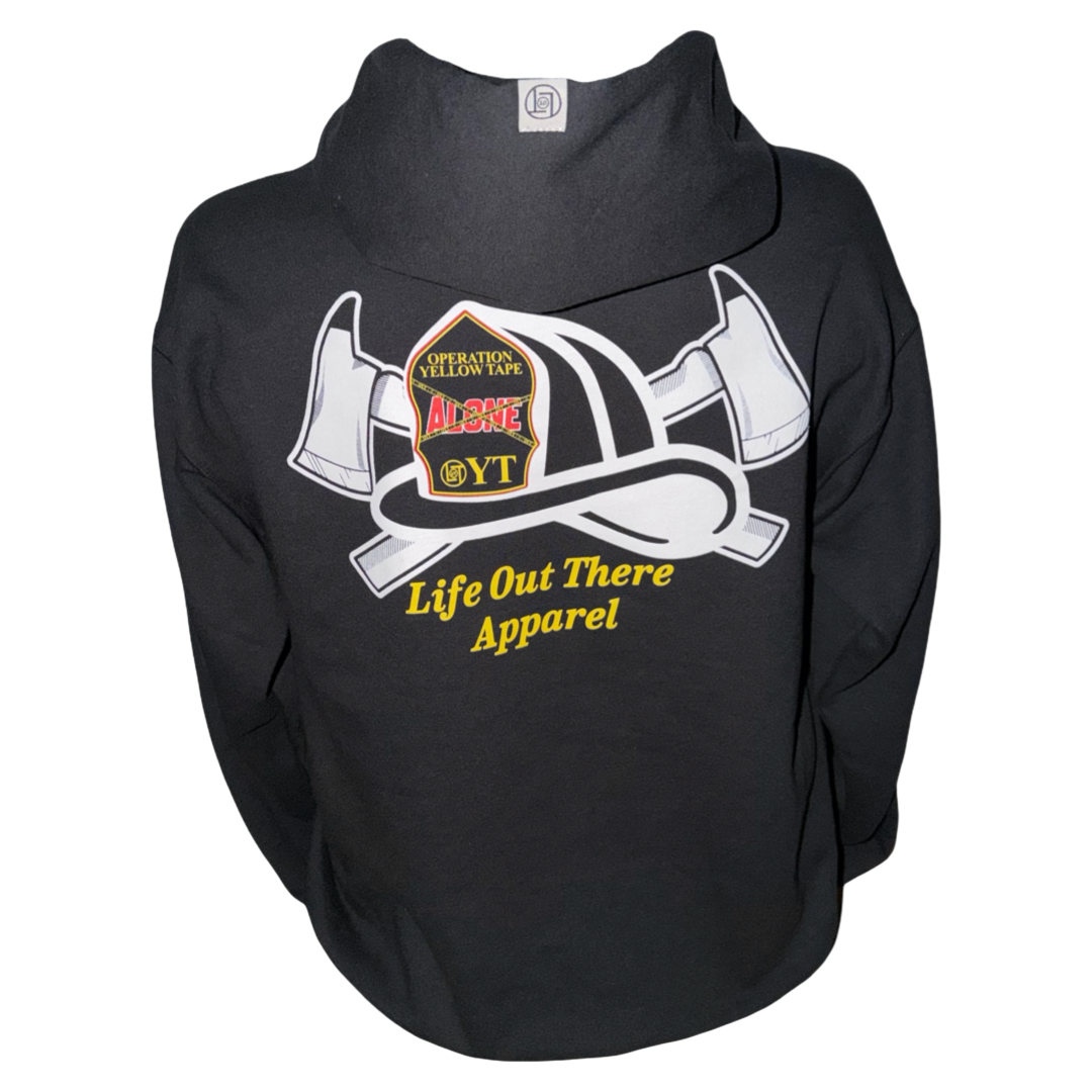 Drop The Shield Hoodie - Black by Life Out There Apparel features a graphic of a firefighter helmet with two axes and yellow text. This unisex hoodie is crafted from a comfortable cotton-polyester blend and has a tagless neck for extra comfort. The helmet displays patches reading “Operation Yellow Tape” and “Alone OYT.”.