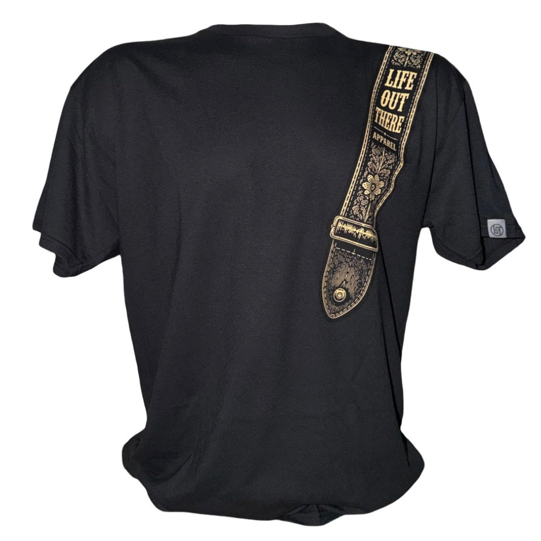 Introducing the Category Hurricane Tee - Black by Life Out There Apparel. This unisex T-shirt showcases a printed guitar strap design over the right shoulder, highlighted by “LIFE OUT THERE APPAREL” in vintage-style yellow text. Made from a soft cotton-polyester blend and finished with a tagless neckline for extra comfort.