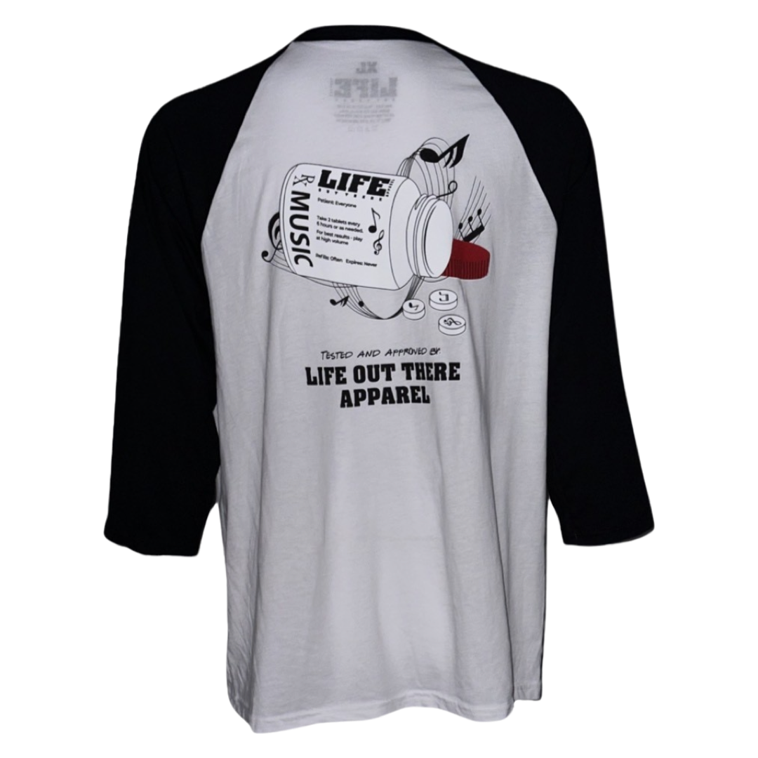 Black & White Life Out There Apparel “Music Is Medicine “ Unisex Raglan 3/4 tee shirt is a medicine pill bottle tipped over with pills that have fallen out, that have music notes on them. This photo is of the back of the shirt on a white background. 