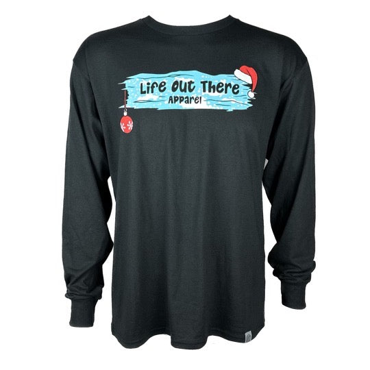 Life Out There Apparel “December 26th” black Unisex long sleeve tee shows Santa Clause camping in the desert, in a travel trailer, while relaxing after the big day and burning his Christmas tree, all inside a Christmas ornament - front of the shirt. 