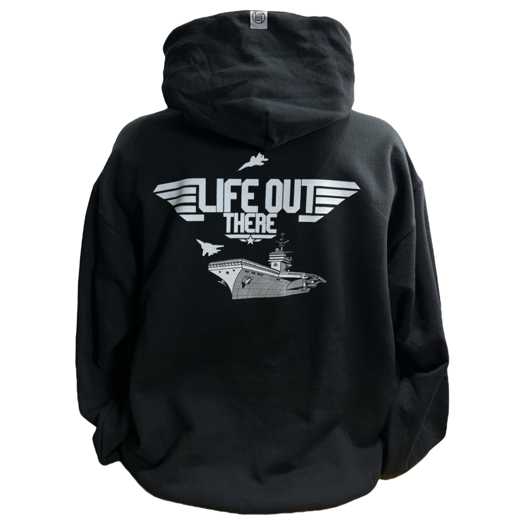 The back of the Unisex - The Hard Deck Hoodie by Life Out There Apparel shows white graphics of an aircraft carrier and three fighter jets, with LIFE OUT THERE in bold text above, framed by stylistic wings, echoing a TOPGUN vibe.