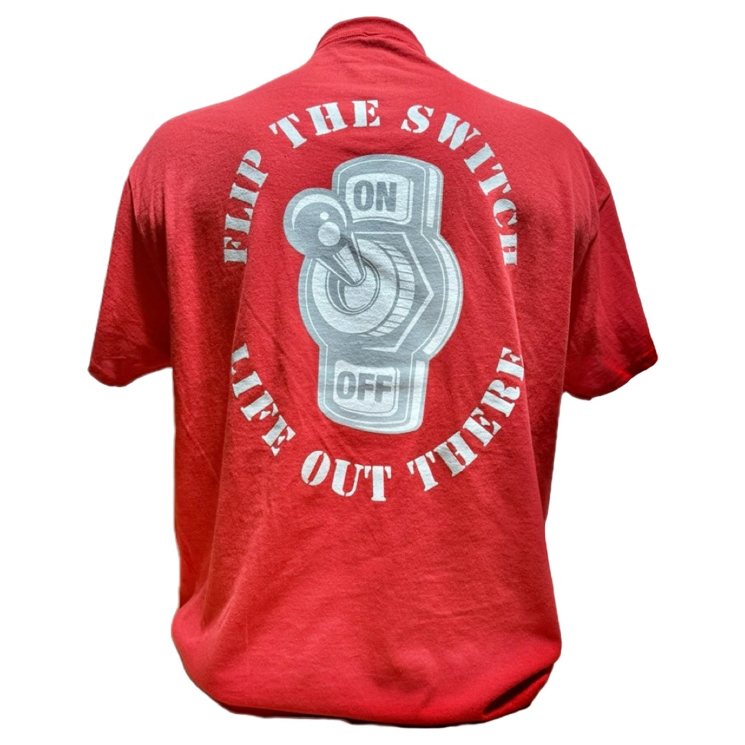 The Unisex - Flip the Switch Tee in Red by Life Out There Apparel, launched for their anniversary, features a metallic switch graphic with ON and OFF positions, encircled by bold white text: FLIP THE SWITCH above and LIVE OUT THERE below.