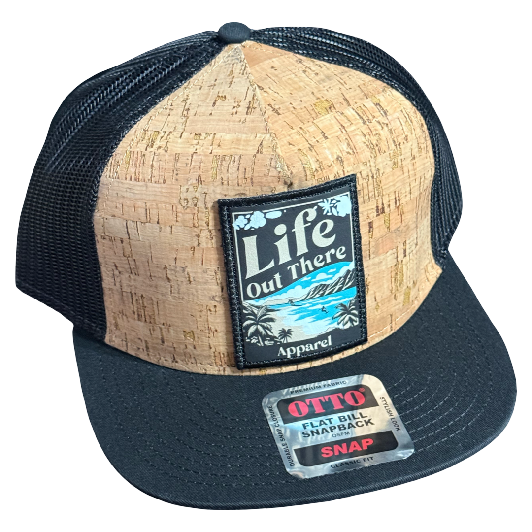 The ALOHA Flat Bill SnapBack Trucker Hat by Life Out There Apparel features a cork and black mesh design with a tropical Life Out There patch, OTTO Flat Bill Snapback sticker, and Hawaiian-inspired style.