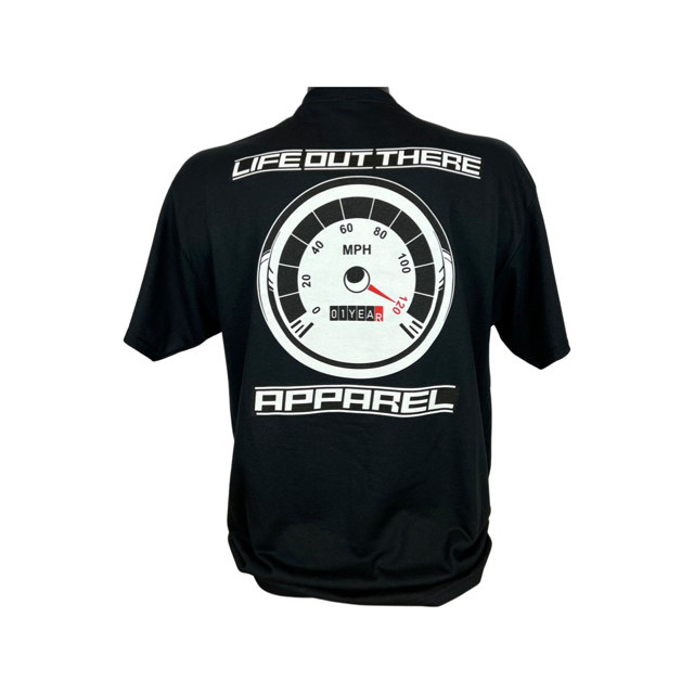 Life Out There Apparel “On My Way” Black Unisex tee shirt is the 1 year anniversary design that has a big speedometer on it - pegged at 120 mph & the odometer is rolling over 1 Year. This photo shows a man showing the design on the back of the shirt with a white background. 