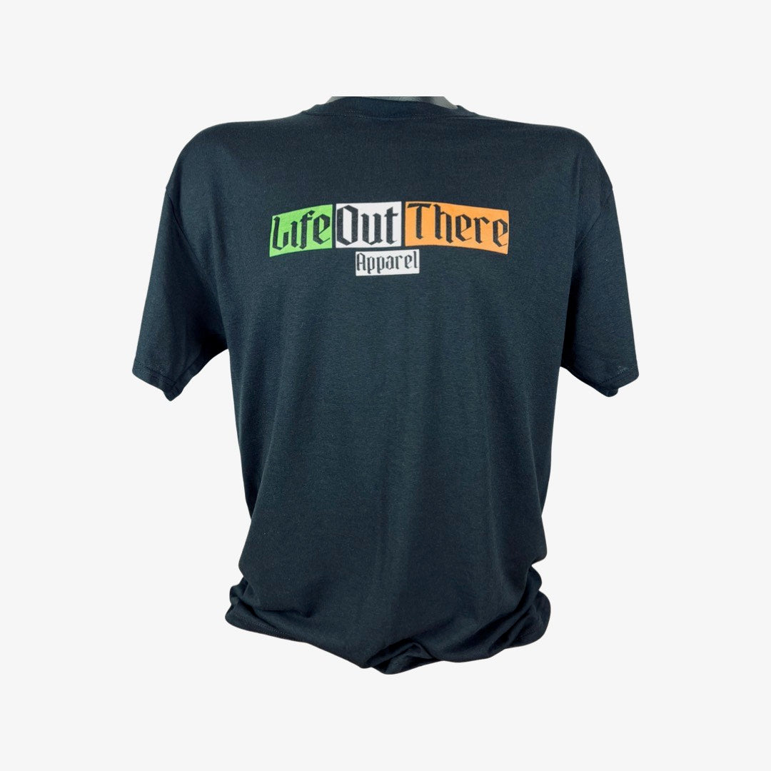 Life Out There Apparel “Capt. Patrick” Unisex black tee shirt is a collaboration of an American flag with an Irish twist and a leprechaun boat Captain looking on. the front of the shirt has an Irish flag design on it. 